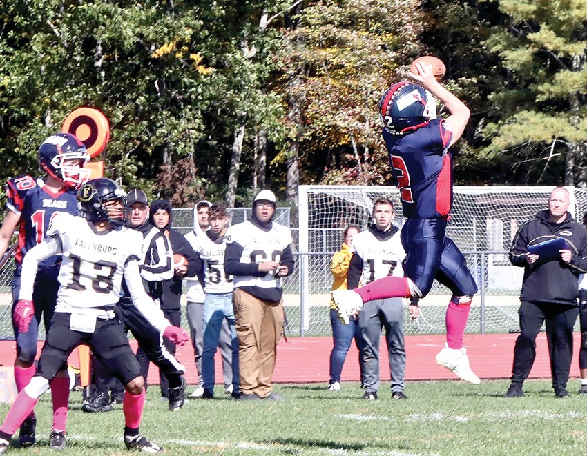 Showing his prowess on defense as well as his uncanny offense, Austin Hartman goes aloft to snare an interception.