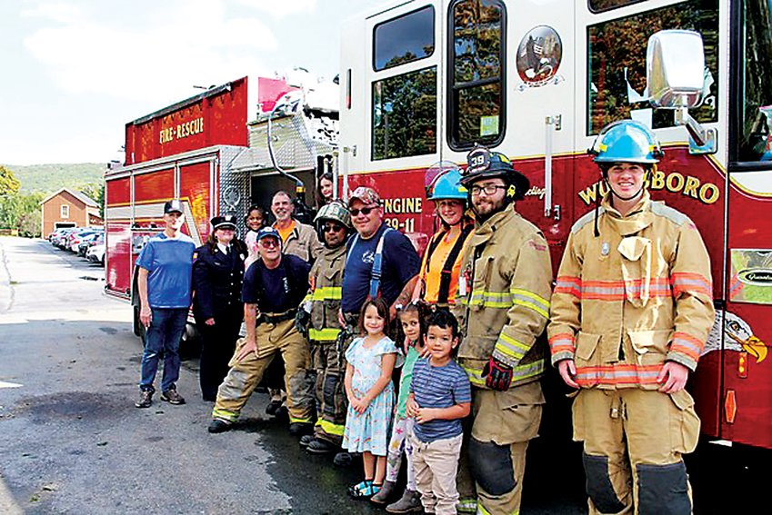 Members of the Wurtsboro Fire Department pose with Chase students.