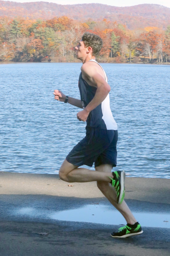 Section IX Class D champion Adam Furman runs along Hessian Lake with a commanding lead.