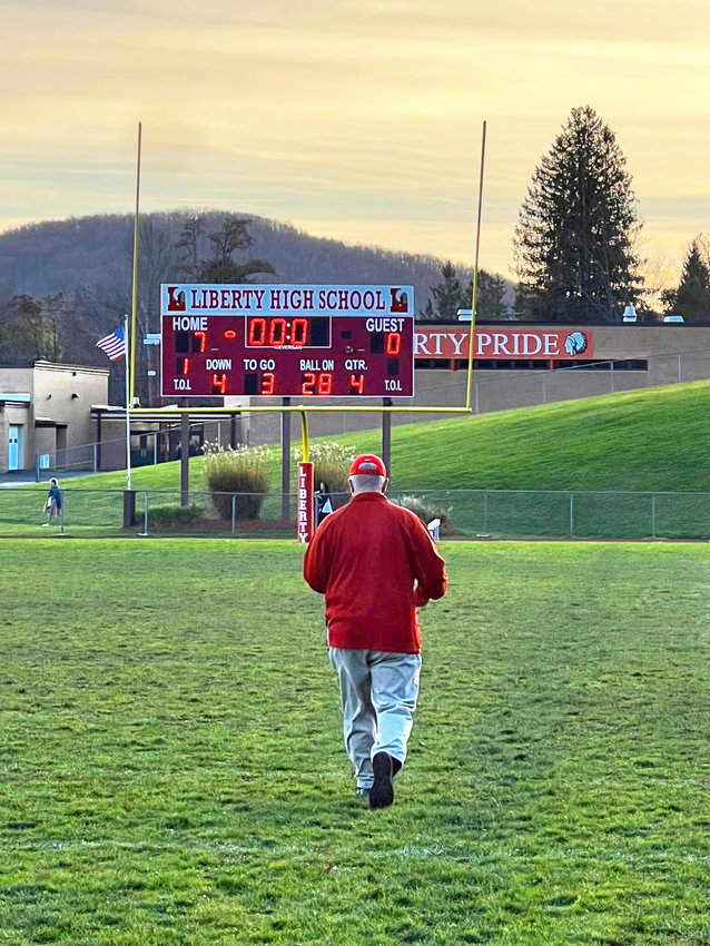 Coach O&rsquo;Connor walks off the Liberty football field one last time.