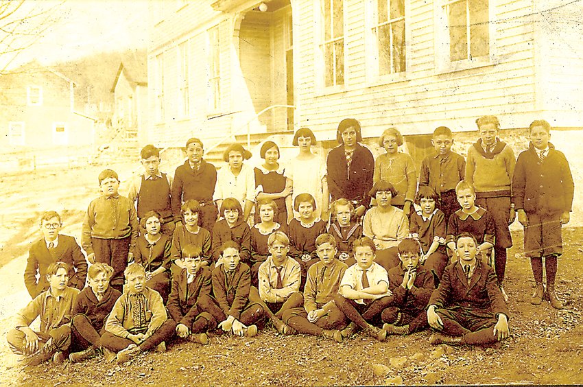Name that class:     Our thanks to Patricia Peters of North Branch for sharing this photo. The children gathered here appear to be an early grade school class in front of the Callicoon Union School, founded in 1902 (the building was not built until years later). The prevailing hairstyle of these girls seems to be the bob, which wasn&rsquo;t widely popular until after the 1920s. The pair of girls in the center of the group wearing identical lace collars might be siblings, perhaps even twins. Can any of our readers shed a light on the year that this photo might be from, or tell us who any of the students are? If you know, please call Ruth at our Callicoon office at (845) 887-5200.