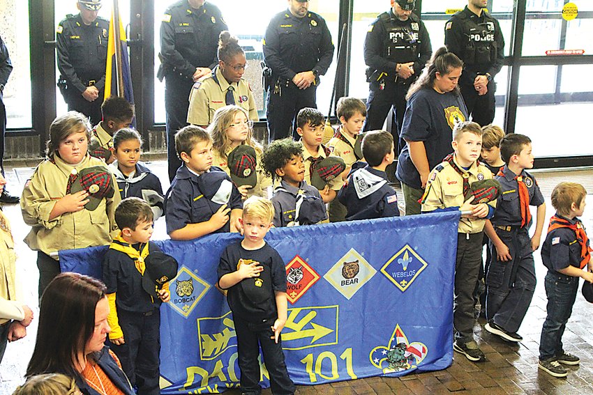 Cub Scouts from Pack 101 remove their hats during Friday&rsquo;s  Veterans Day Ceremony.