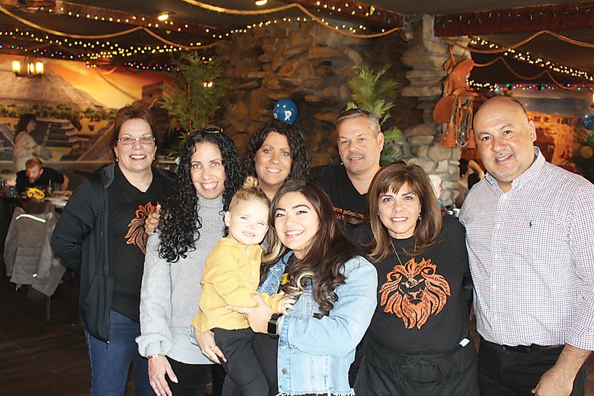 Among those at the fundraiser were (from left) Devin&rsquo;s aunts  Debbie Haupt, Suzie Gold, Nicole Gold, Briana Housman (Devin&rsquo;s sister) holding young Harrison Walsh, Devin&rsquo;s father and mother James and Yvonne Housman and El Sombreros owner Luis Cerna.