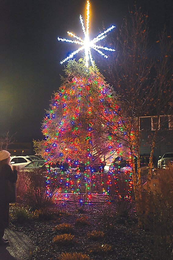A lit moment! This Christmas tree sits at the Main Street rail trail entrance.