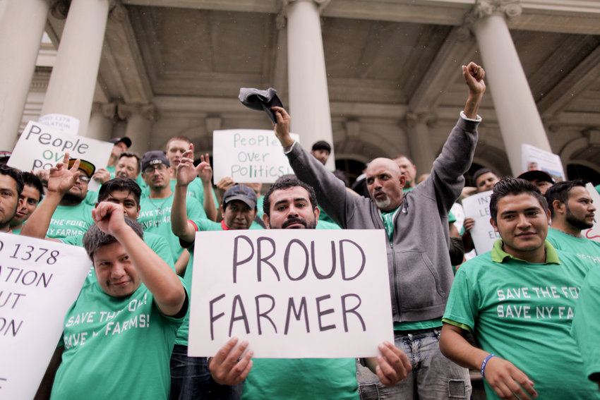 Duck farm workers on the steps of New York City Hall in 2019 protesting the ban, which for now will not go into effect after review by the New York State Department of Agriculture and Markets.