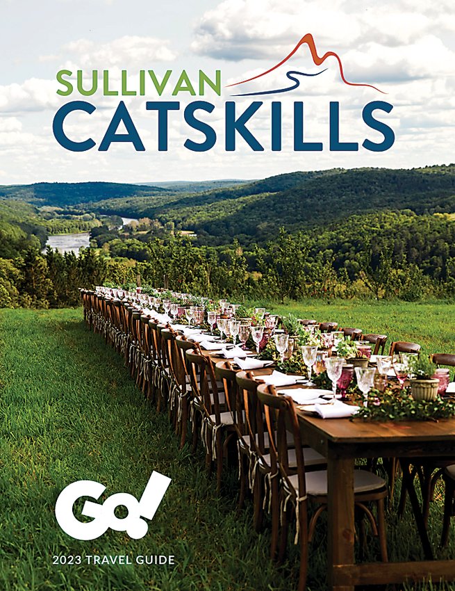 The cover of the Sullivan Catskills 2023 Travel Guide features The Farmhouse Project&rsquo;s Terrain and Table dinner series at Seminary Hill Cidery in Callicoon.