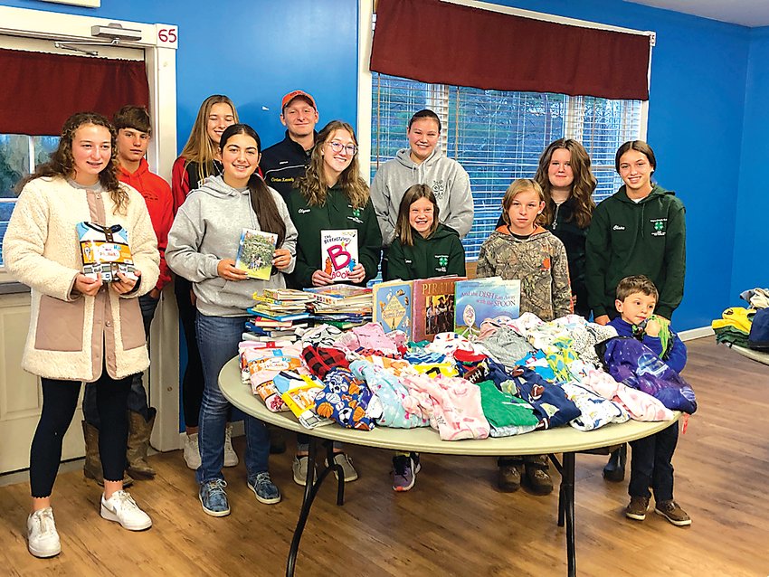 Tri-Gal 4-H Club shown with their collection of Pajamas and Books for Wayne County Children and Youth at their November meeting.