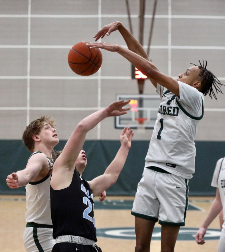 Eldred freshman Trai Kaufmann authoritatively blocks a shot by Sullivan West&rsquo;s Jakob Halloran but ended up fouling him on the downward motion. Kaufmann, normally a key scorer, was off his game on the offensive end.