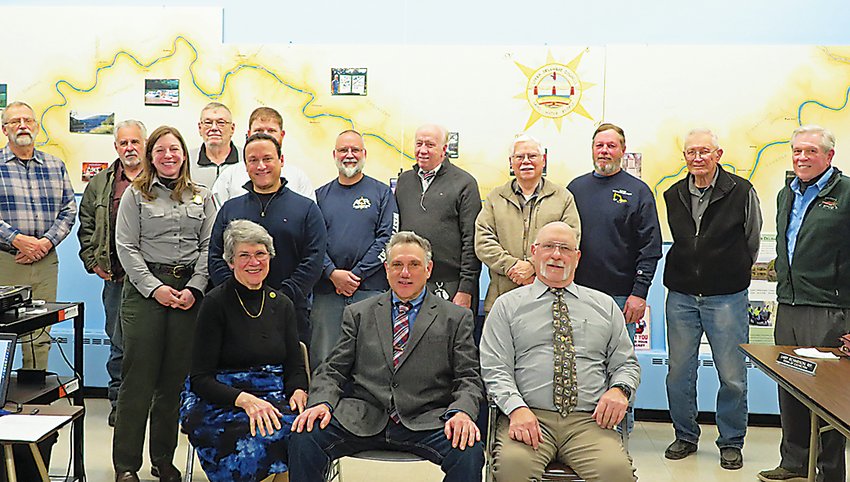 Gathered at the Feb. 2 Upper Delaware Council meeting were, seated from left, Vice-Chairperson Virginia Dudko, Chairperson Aaron I. Robinson, and Secretary-Treasurer Alan F. Henry. Standing from the left are Jeff Dexter, Roger Saumure, Lindsey Kurnath, Bill Dudko, Tim Dugan (partially hidden), Frank Guzman, Michael Barth, Larry Richardson, Harold Roeder, Jr., Doug Case, Jim Greier and Andy Boyar. Participating by Zoom were Ryan Coulter (State of New York), Kristin Bowman Kavanagh (Delaware River Basin Commission), Nadia Rajsz, and Fred Peckham, while Evan Padua, was absent.