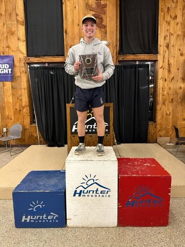 Austin Hartman stands atop the podium showing off his plaque. He finished on top of Section IX and will represent Tri-Valley and Sullivan County at the State Championship on Monday and Tuesday in Bristol.