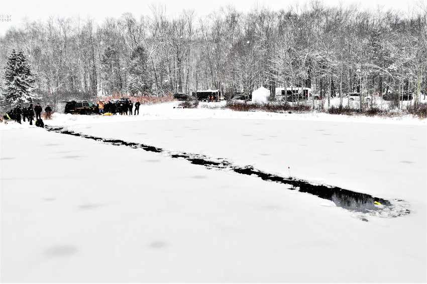 Divers cut a path through the ice to reach the victims.