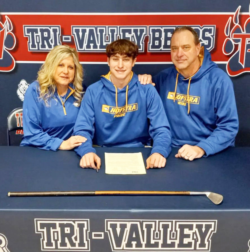 Gavin Clarke, center, officially committed to Hofstra University at a recent signing at Tri-Valley High School. He&rsquo;s pictured with parents Judith and Brent.