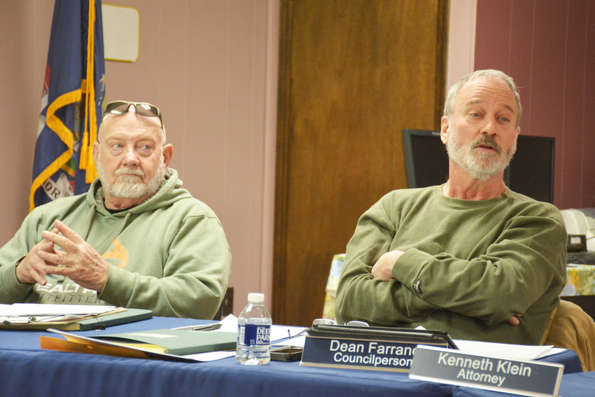 Liberty Councilmen Dean Farrand, right, and John Lennon, left, during discussion about possible amendments to the Town code regarding schools and houses of worship.