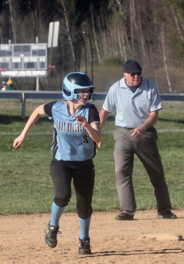 Sullivan West junior Nicole Reeves advances on the base paths after yet another passed ball yielded by Burke pitcher Demi Giannetto. Reeves would also come on in relief of her twin sister Liz to close out the game.
