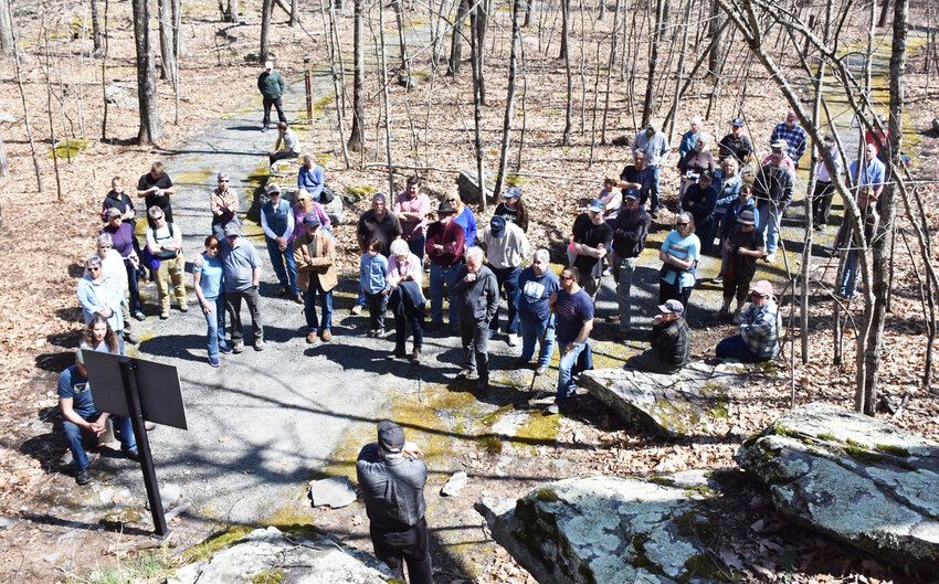 Some of the participants at last year&rsquo;s Delaware Company sponsored Highland History Hike at the Minisink Battleground Park listening to the hike&rsquo;s narrator, Sullivan County Historian John Conway (forground).