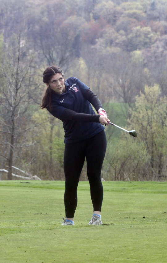 Tri-Valley&rsquo;s standout golfer Kaylee Poppo focuses on her shot near the flag at the division invitational. She shot an impressive 44 to post the best score of the day. Poppo was a state contender a year ago and is hoping to return this spring with an even greater performance.