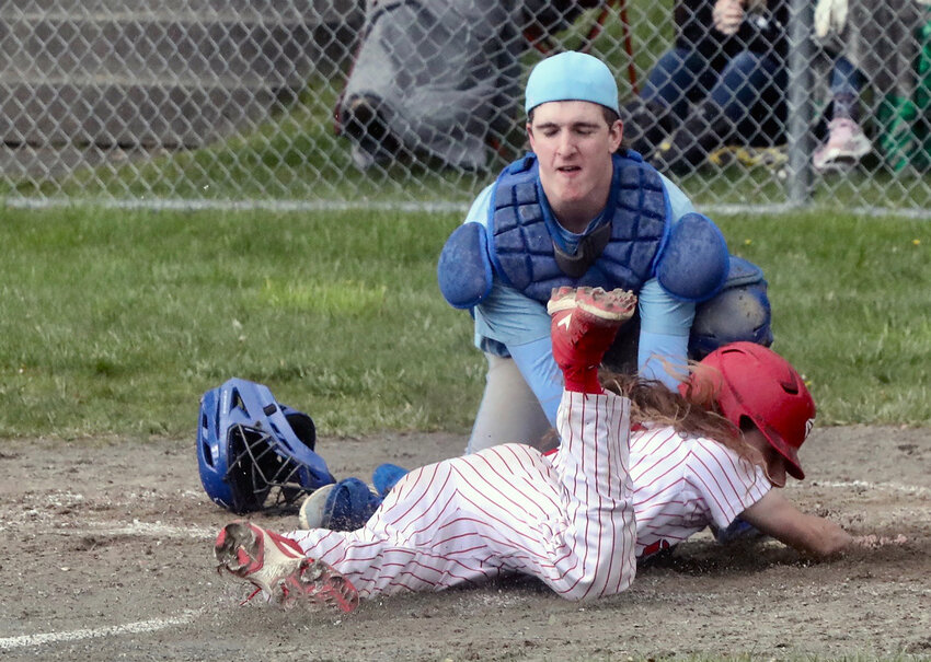 Out at home! Sullivan West senior catcher Jaymes Buddenhagen puts an inning-ending tag on Liberty&rsquo;s Aiden Yaun in the third inning.