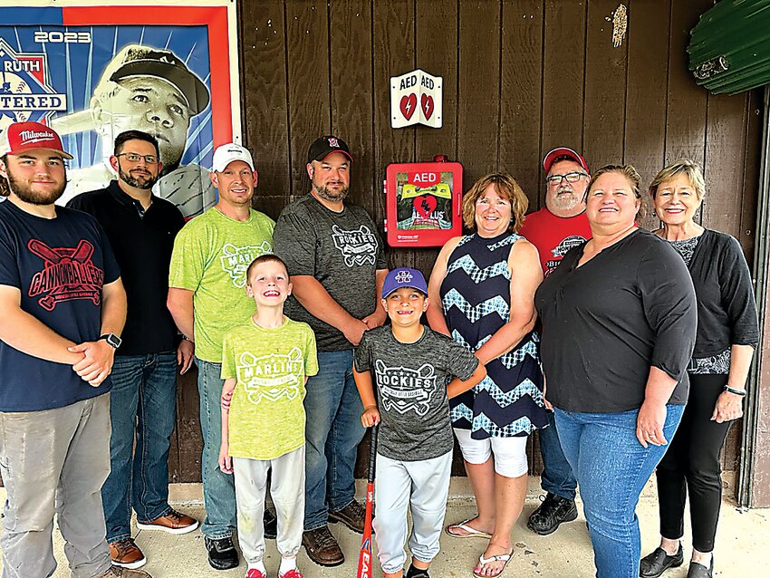 Front: Camden Bunting, Tanner Cottell. Back: Matt Abbott, Chris Tallman, Paul Bunting, Adam Cottell, Rotary Past President Sherry Grandinetti, current President Dana Scott, Charlie Rollison, Rotarian Lisa Champeau.