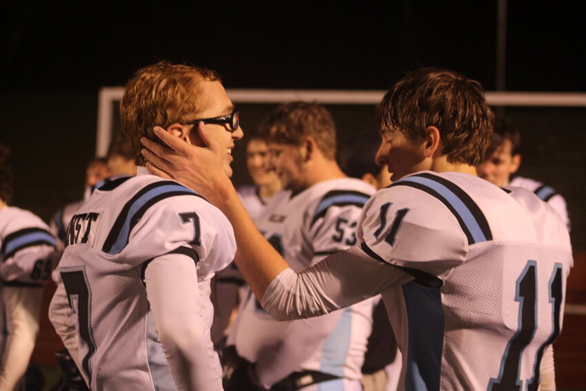 Senior Allyn Walter and junior Adam Ernst embrace after the loss.