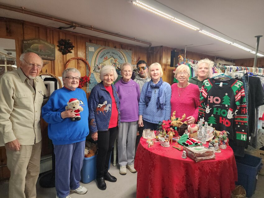 From left, Bob Owens, Joanie Booth, Martha Johnson, Nellie Culligan, Michael Manacello, Mila Schomberg, Pat Phipps and Laurie Clarke at Noah’s Arch Thrift Shop in Monticello.