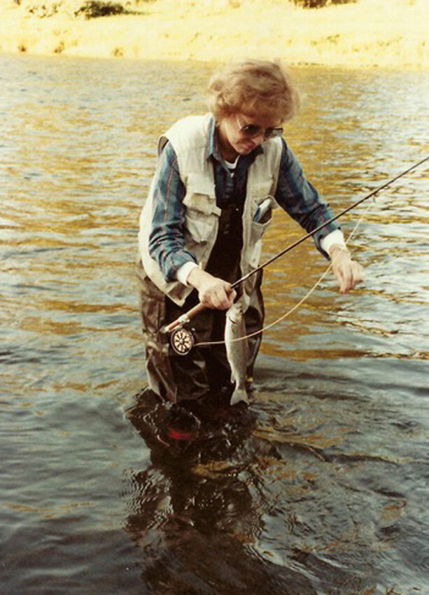 Left: Former First Lady Rosalynn Carter releasing her catch.