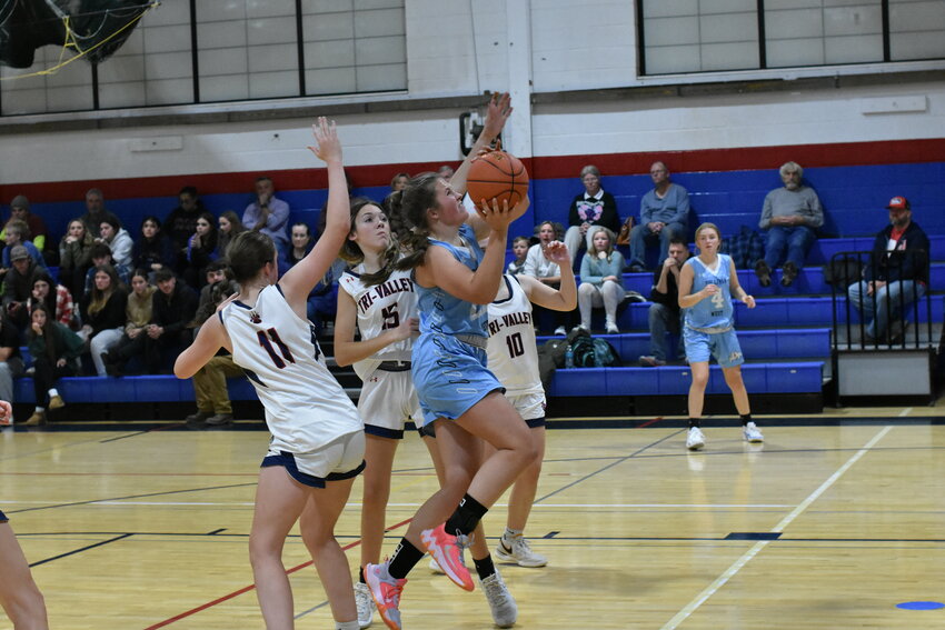 Sullivan West&rsquo;s Karlee Diehl makes a contested drive to the basket.