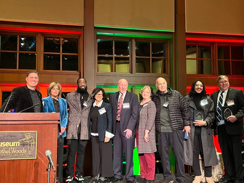 Sullivan Catskills Visitors Association (SCVA) leadership joined 2023 Tourism Excellence Award winners at Bethel Woods Center for the Arts. From left, SCVA Vice-Chair Scott Samuelson, SCVA President and CEO Roberta Byron-Lockwood, Michael Davis of the Black Library, Claire Marin of Catskill Provisions, Adam Jacobson of the Villa Roma Resort, Barbara Gref of Bethel Woods Center for the Arts, Bill Sipos, Douglas Shindler of the Black Library and Rick Lander of Lander&rsquo;s River Trips.
