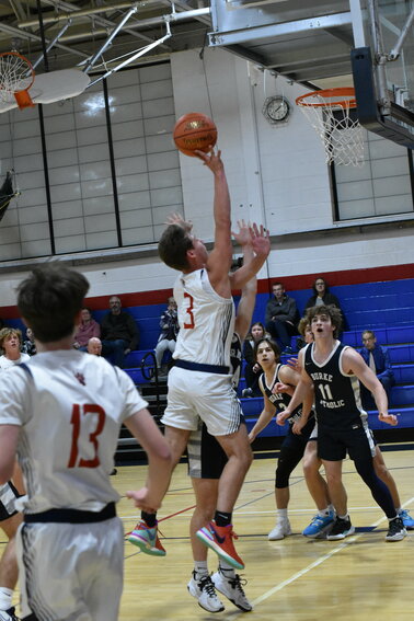 Josh Fanslau lifts off over a defender to convert a layup.