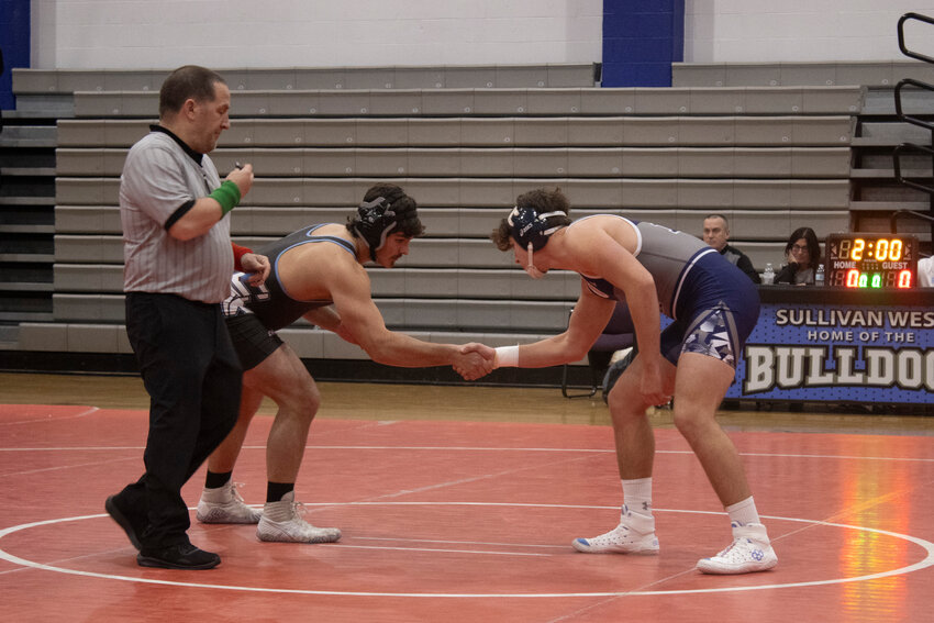 Sullivan West&rsquo;s Rally Cruz shakes hands with Burke Catholic&rsquo;s Frank Shaw before their match on Wednesday, December 20.