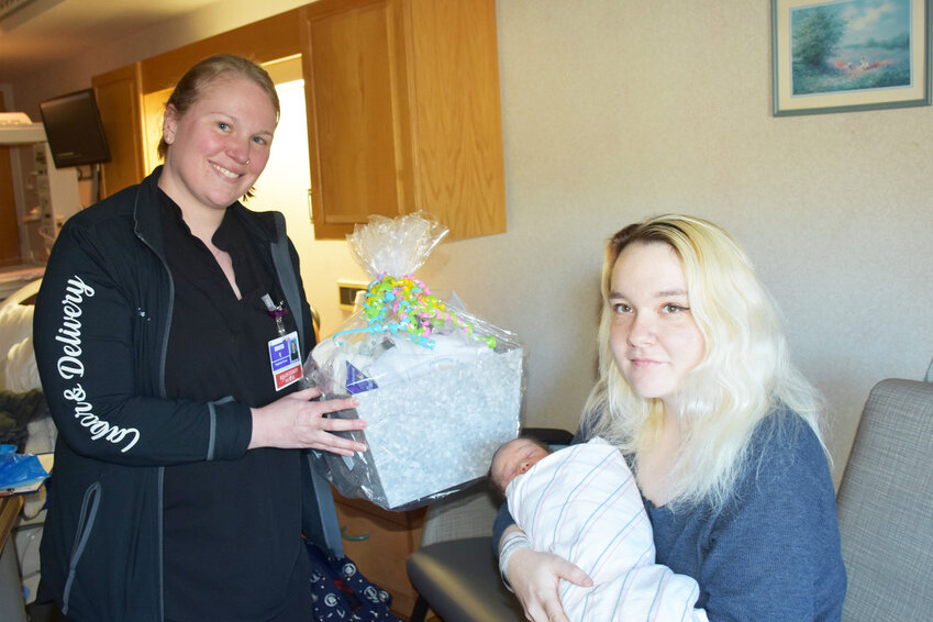 Kristen Yoh, RN with Dakota Lancaster and baby Elijah.