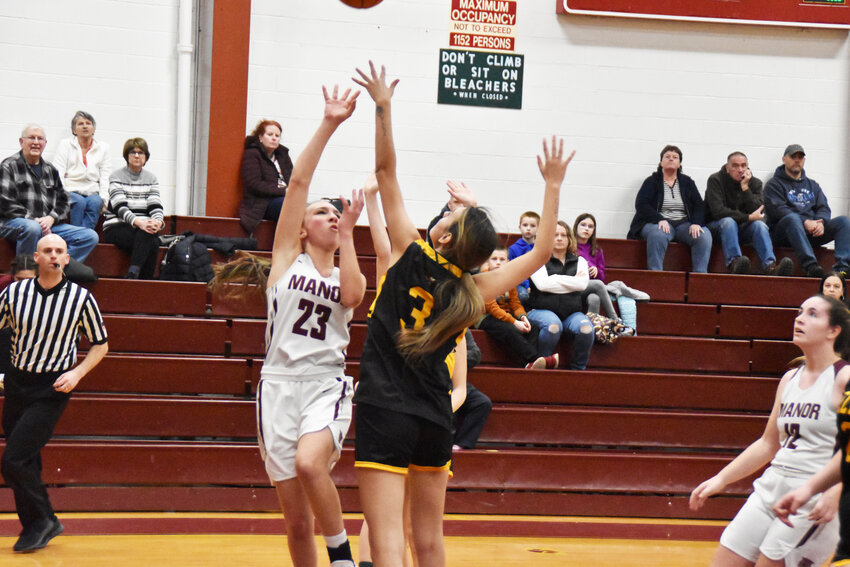 Anastasia Niforatos drives to the basket through contact. Niforatos led the Lady Wildcats with eight points in Monday night&rsquo;s loss.