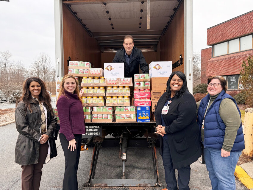 Garnet Health staff received its first delivery of 1,000 pounds  of food from the Regional Food Bank of Northeastern of New York on February 1. From left: Nicole Sewell, Garnet Health Medical Center&rsquo;s Chief Nursing Officer and VP of Patient Care; Moira Mencher, Garnet Health&rsquo;s Director of Strategic Planning and Community Relations; John Politoski, Security (on the truck); Magalie Jean-Francois, Garnet Health Medical Center&rsquo;s Manager of Hemodialysis Unit; and Maureen Roche, Garnet Health Medical Center&rsquo;s Manager of Volunteer Services.
