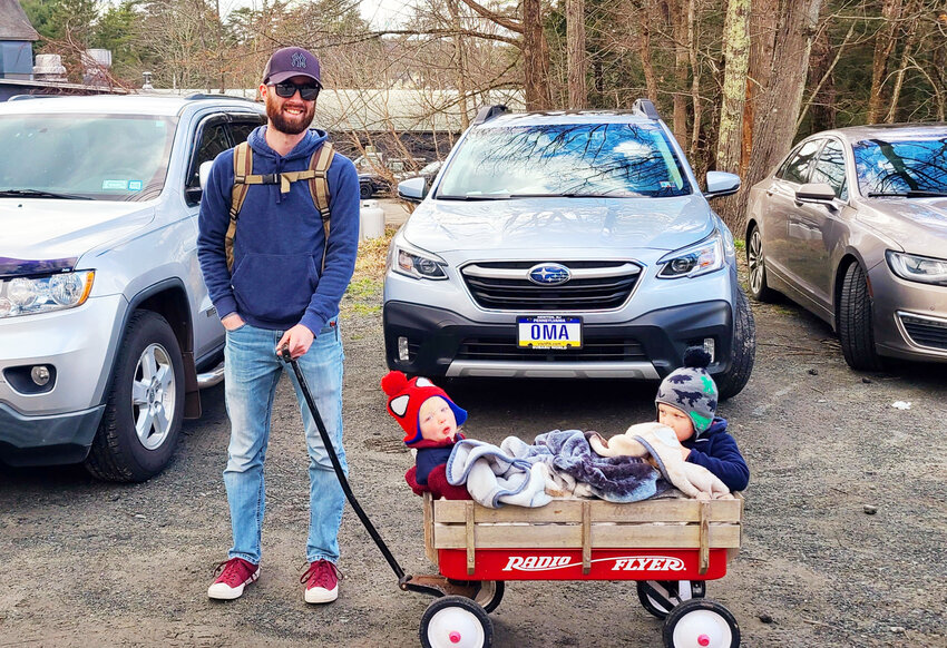 Tyler Schwartz of Yulan had the perfect seating for his children in the family&rsquo;s Radio Flyer red wagon for his son Dawson and daughter Adalynn to see the Parade.