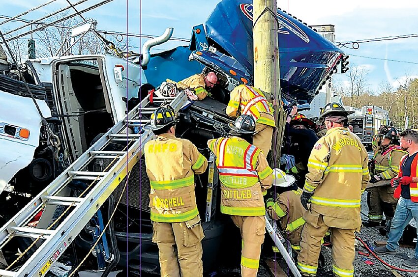 Published in the Sullivan County Democrat, this photo shows firefighters rescuing a truck driver after an accident at the Wurtsboro four corners on April 11, 2023.