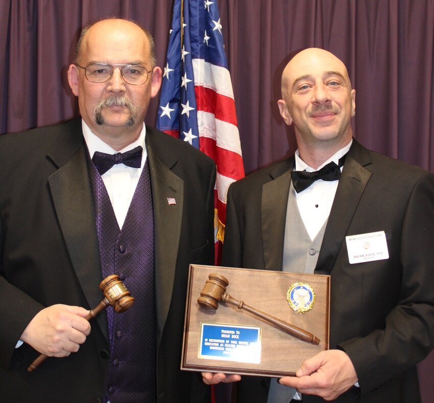 Past Exalted Ruler Brian Bock (right) presents the gavel of authority to new Exalted Ruler Jim Gerrard II at a ceremony on March 23rd. The Monticello Elks Lodge has 337 members.
