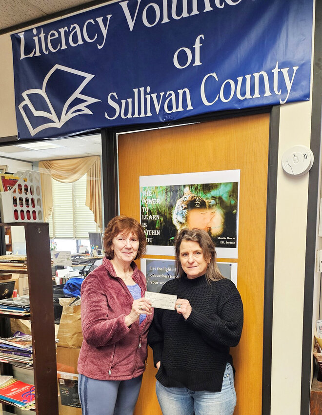Literacy Volunteers received a check for $2,500 from the Wolf Lake Neighbors Foundation.