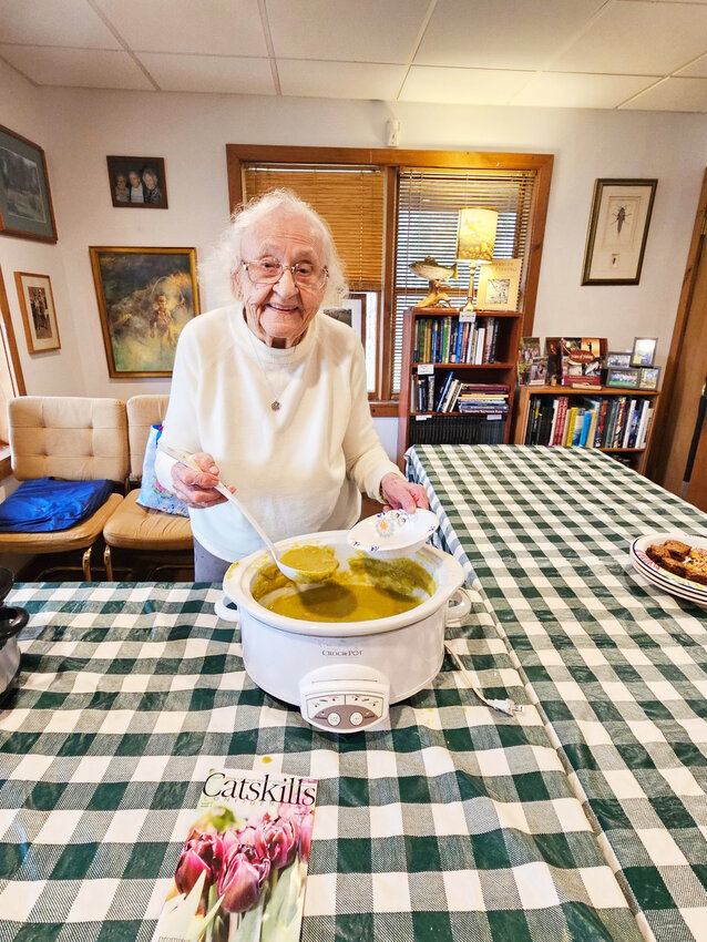 Agnes Van Put, 107 years young, prepares to ladle out her famous homemade soups (split pea with ham and chicken meat ball with rice) at the Catskill Fly Fishing Center&rsquo;s Gift shop.