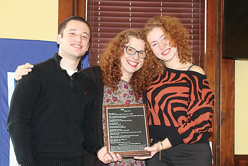 Sullivan County 2022-2024 Poet Laureate Dr. Sharon Kennedy-Nolle, middle, poses with Joseph Sullivan and Nicol Sikorski with their collaborative poem, &ldquo;FAQ&rsquo;s - A Segue Poem&rdquo;&ndash; immortalizing their healing onto a plaque.