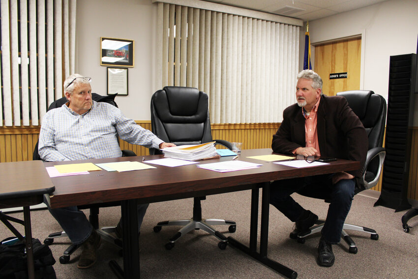 Town Supervisor Chris Mathews (right) discussed the progress the Town was at with the pool leak situation. At left, Councilperson Jim Schmidt listened on.