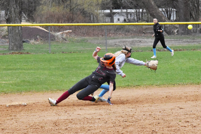 Zaylee Cox slides safely into second, advancing after a single.