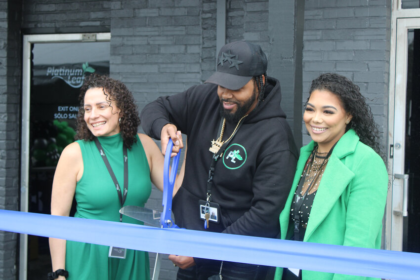 Dawn of Platinum Leaf, left, and co-owners Bernard and Chyna Gonzalez celebrate their ribbon cutting on Friday, April 19.