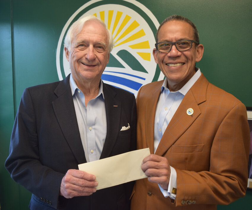 Co-founder of the Wolf Lake Neighbors Foundation Don Kennedy (left) and SUNY Sullivan Foundation Chair member Jose Herrera together holding the scholarship.