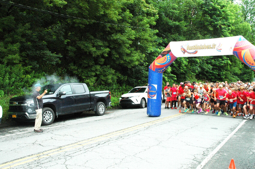 Runners get set to get off the starting line of the 25th Annual River Run last year.