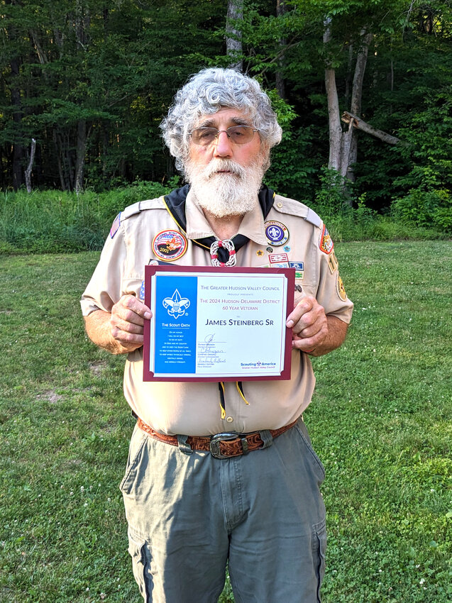 Jim Steinberg Sr. of Troop 101 Rock Hill displays his Hudson-Delaware District certificate for 60 years in Scouting.