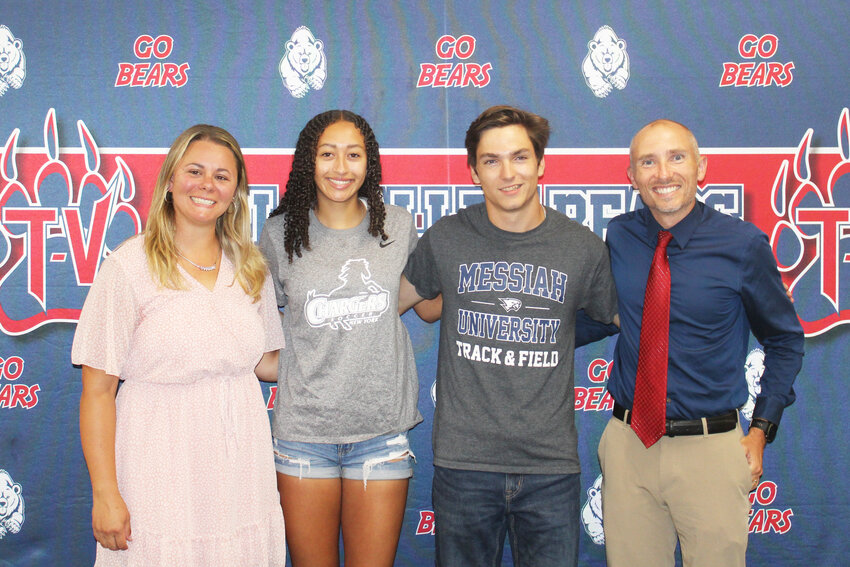 Girls Varsity Soccer Coach Kayla Connolly, left, and Indoor and Outdoor Track and Cross Country Coach Tyler Eckhoff, right, celebrate their athletes, Kendall McGregor and Noah Edwards signing to colleges.