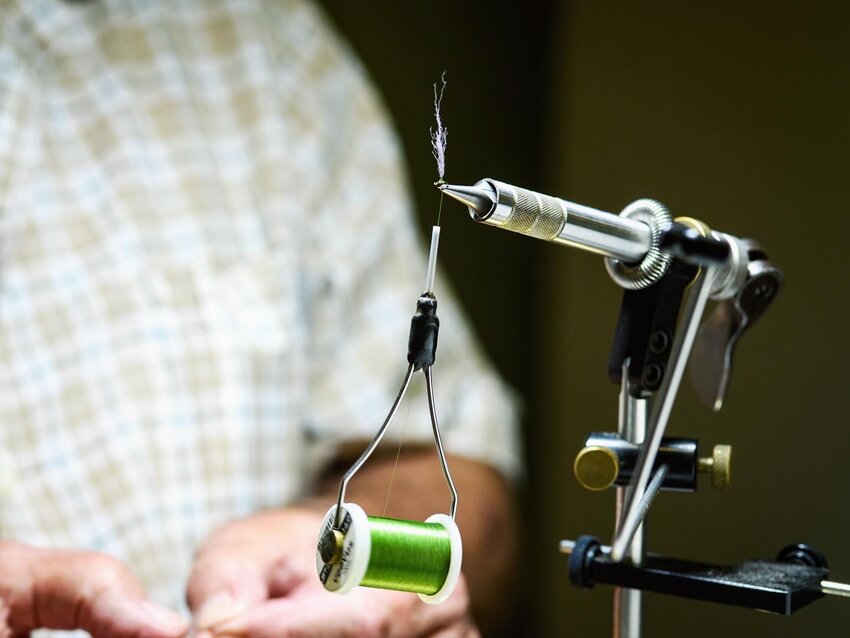Tying a fly with thread in the bobbin.
