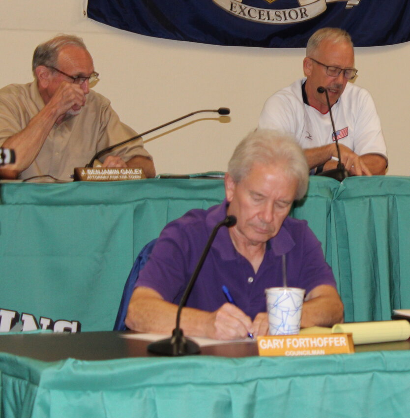 Councilman Jim Post, right, talked of a recent meeting in which billboards were discussed to be placed alongside Wurtsboro Mountain Road. Councilmen J. Benjamin Gailey, left, and Gary Forthoffer, below, listen on.