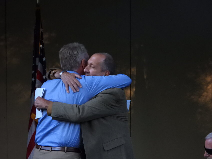 Communities across Sullivan County held their annual memorial ceremonies on Wednesday, fulfilling their steadfast promise to never forget the tragic events of September 11, 2001, which has since been renamed as Patriot Day. Above, Liberty Supervisor Frank DeMayo embraces John Veleber after giving his testimony from the dark day. More coverage from the 9/11 ceremonies will appear in upcoming editions.