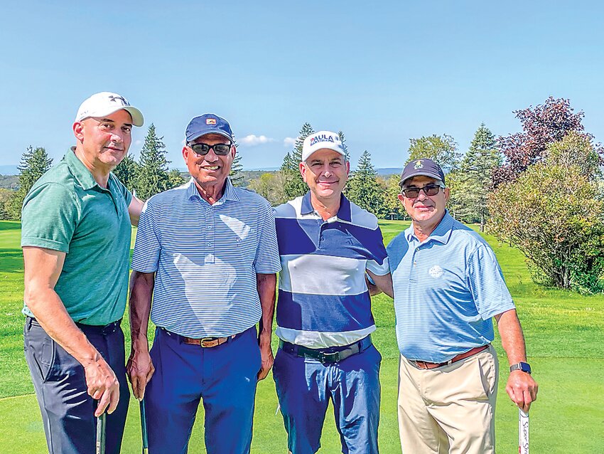 Winning team, from the left, was Mark Garro, Praveen Singh, Nathan Steingart and Ira Steingart.