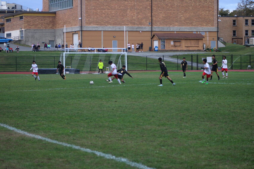 The Comets defense looks to get the ball back against the RedHawks.